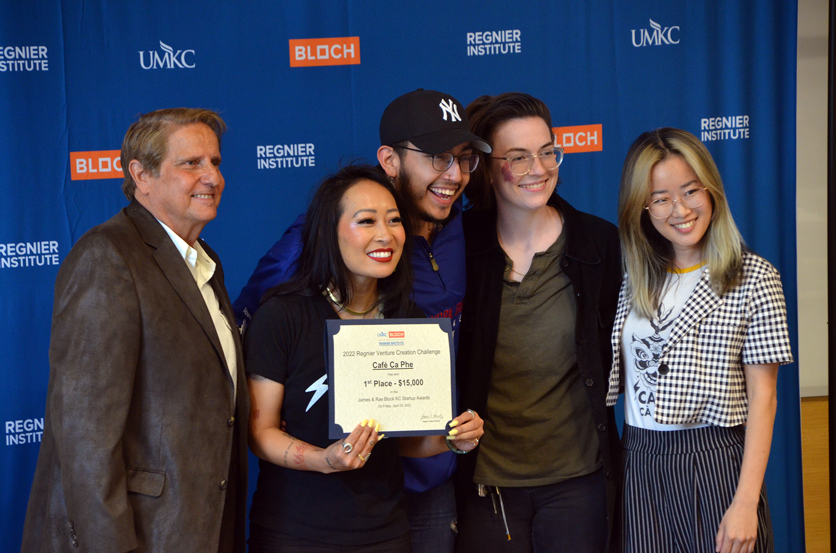 Jackie Nguyen, founder and owner of Cafe Cà Phê, and her team accept first-place honors in the James and Rae Block Kansas City Startup Awards at the Regnier Venture Creation Challenge