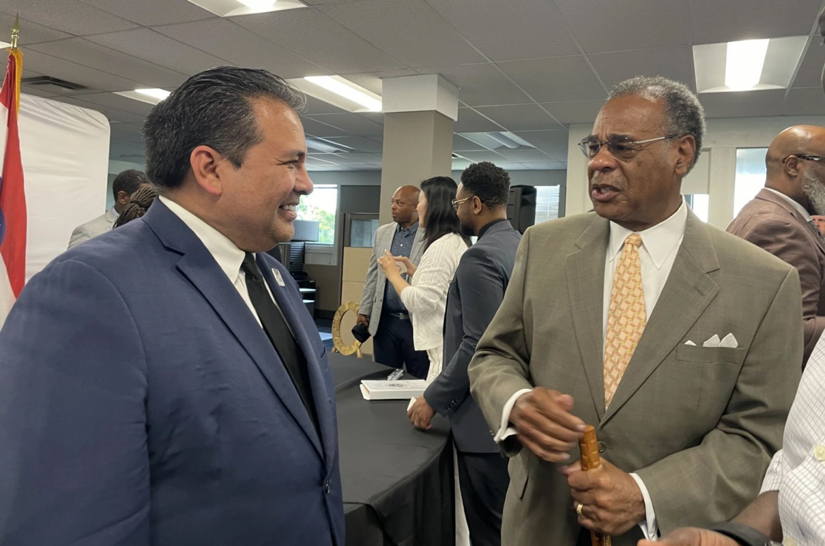 Carlos Gomez, president and CEO of the Hispanic Chamber of Commerce of Greater Kansas City warmly greeted U.S. Rep. Emanuel Cleaver, whose help allowed for the purchase of a building that will house a joint minority business development center with the Heartland Black Chamber of Commerce; photo by Mary Sanchez, Flatland