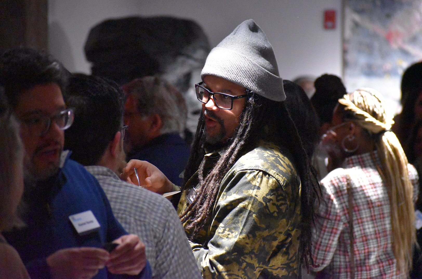 Phil "Sike Style" Shafer, a muralist and art entrepreneur who founded Sike Style Industries, talks with fellow Small Business Superstars during a packed KC Chamber reception at the Zhou B. Art Center; photo by Tommy Felts, Startland News