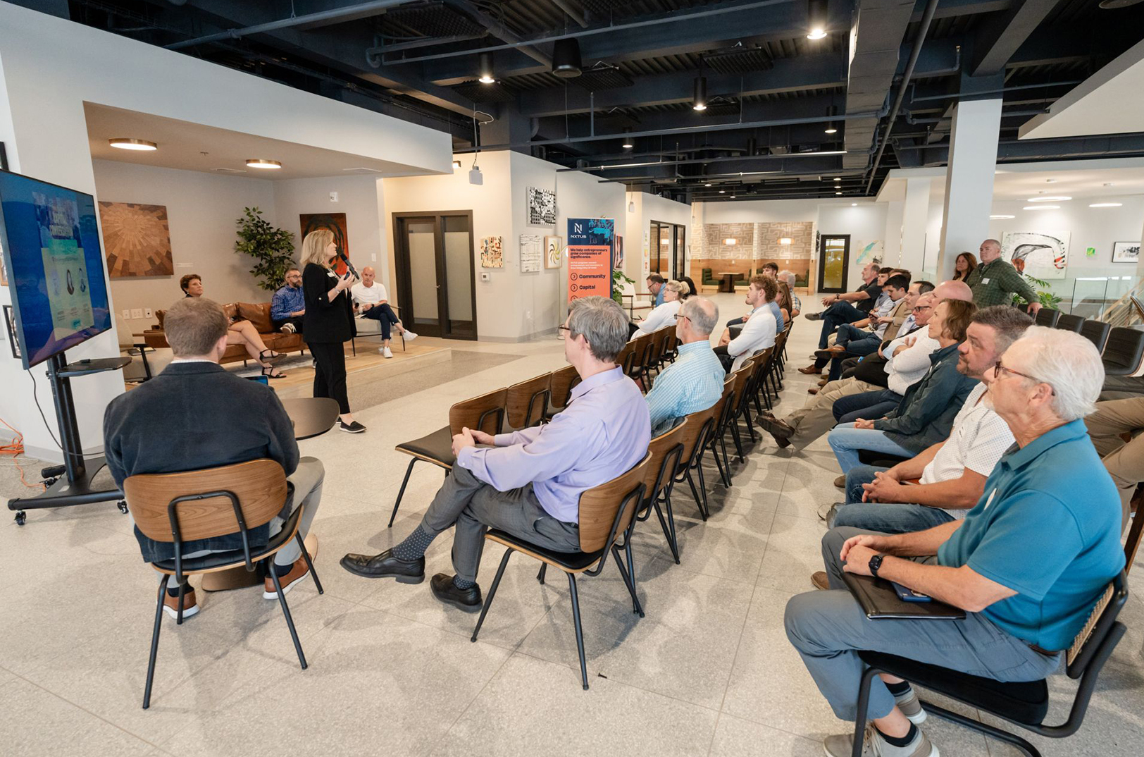 Mary Beth Jarvis, NXTUS, speaks to a crowd of startup founders, investors and innovation champions during a previous NXTUS event at the Commerce Club in Wichita; photo courtesy of NXTUS