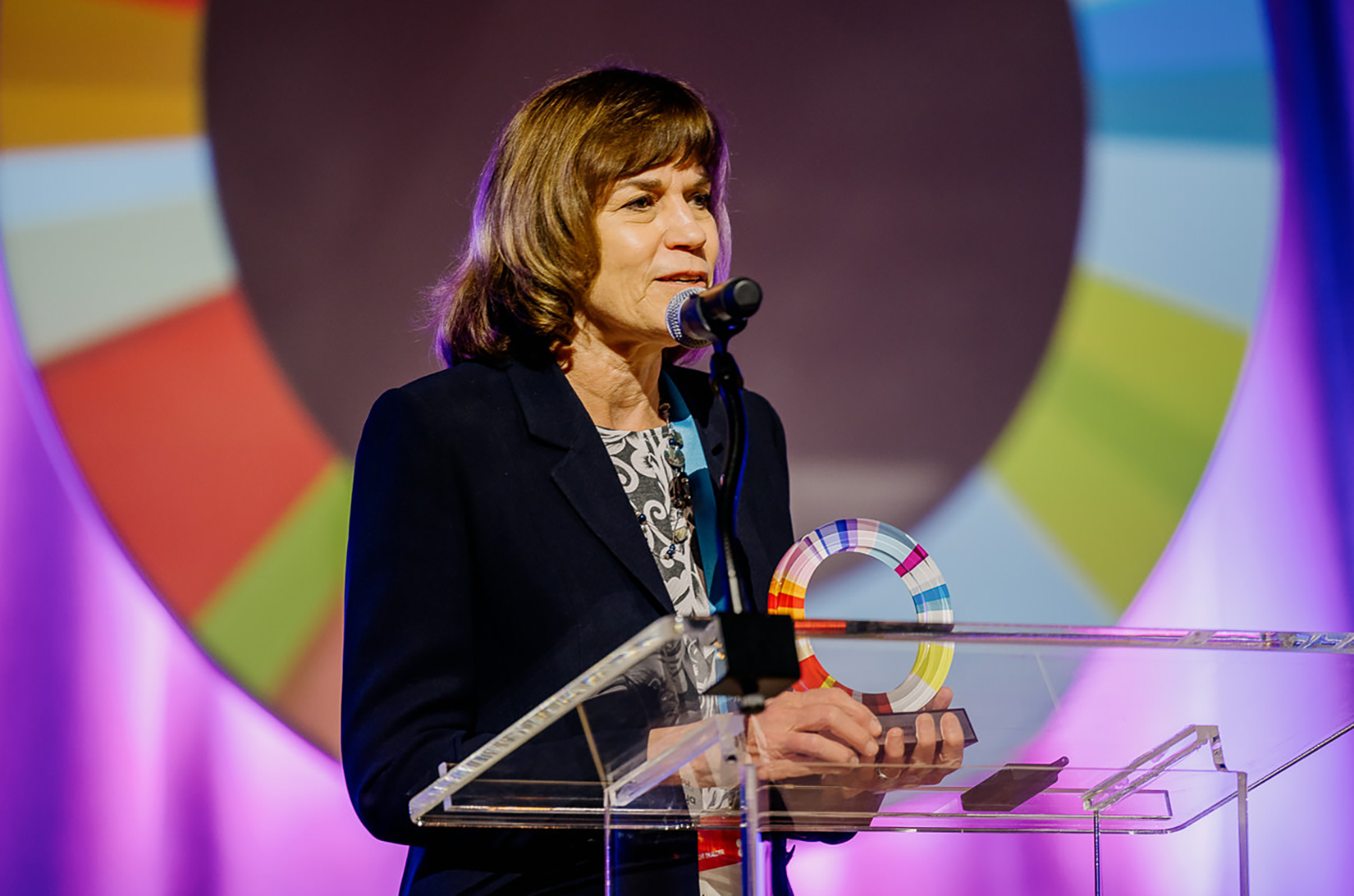 Maria Meyers, founder of SourceLink, accepts the Ecosystem Champion Award at the Global Entrepreneurship Conference June 3 in Indianapolis; photo by Sean Molin