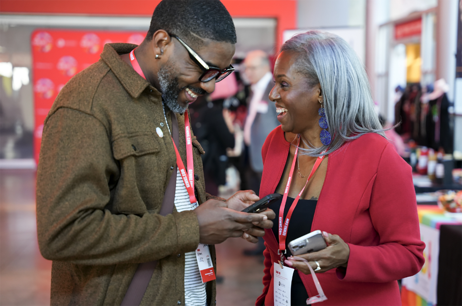 Small business community organizers and entrepreneurs Rickey Leathers, Savvy Salon, and Victoria Campbell Osborne, The Scented Webb, share a laugh during Global Entrepreneurship Week Kansas City in 2024; photo courtesy of KCSourceLink