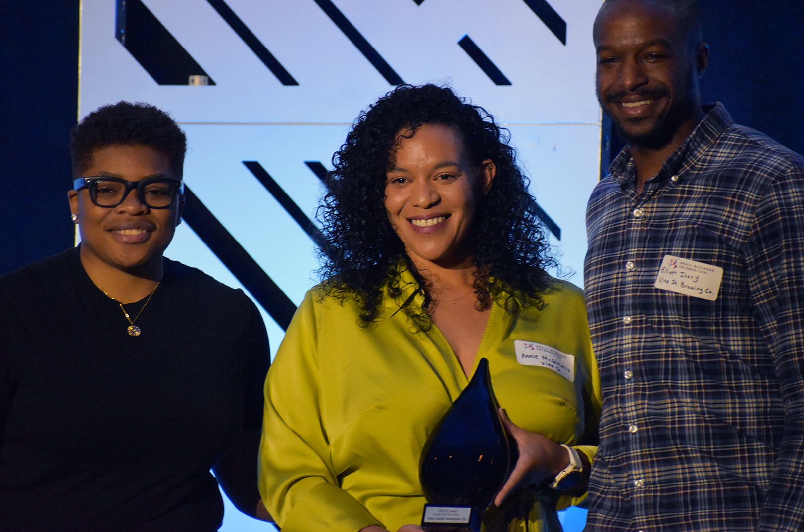 Jannae Gammage, Cyphr, presents Annie McGinnis and Elliott Ivory, Vine Street Brewing, with the KC Chamber's Emerging Small Business Award; photo by Taylor Wilmore, Startland News