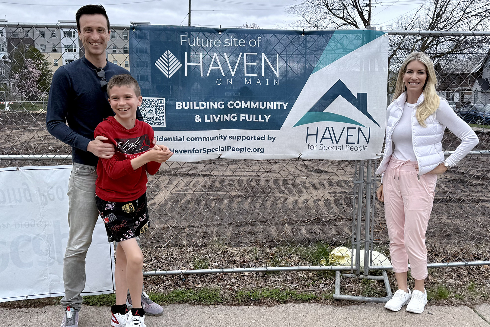 Michael, Brody, and Brandy Rea stand near the future site of Haven on Main, a first-of-its-kind affordable housing complex in downtown La Crosse, Wisconsin; courtesy photo