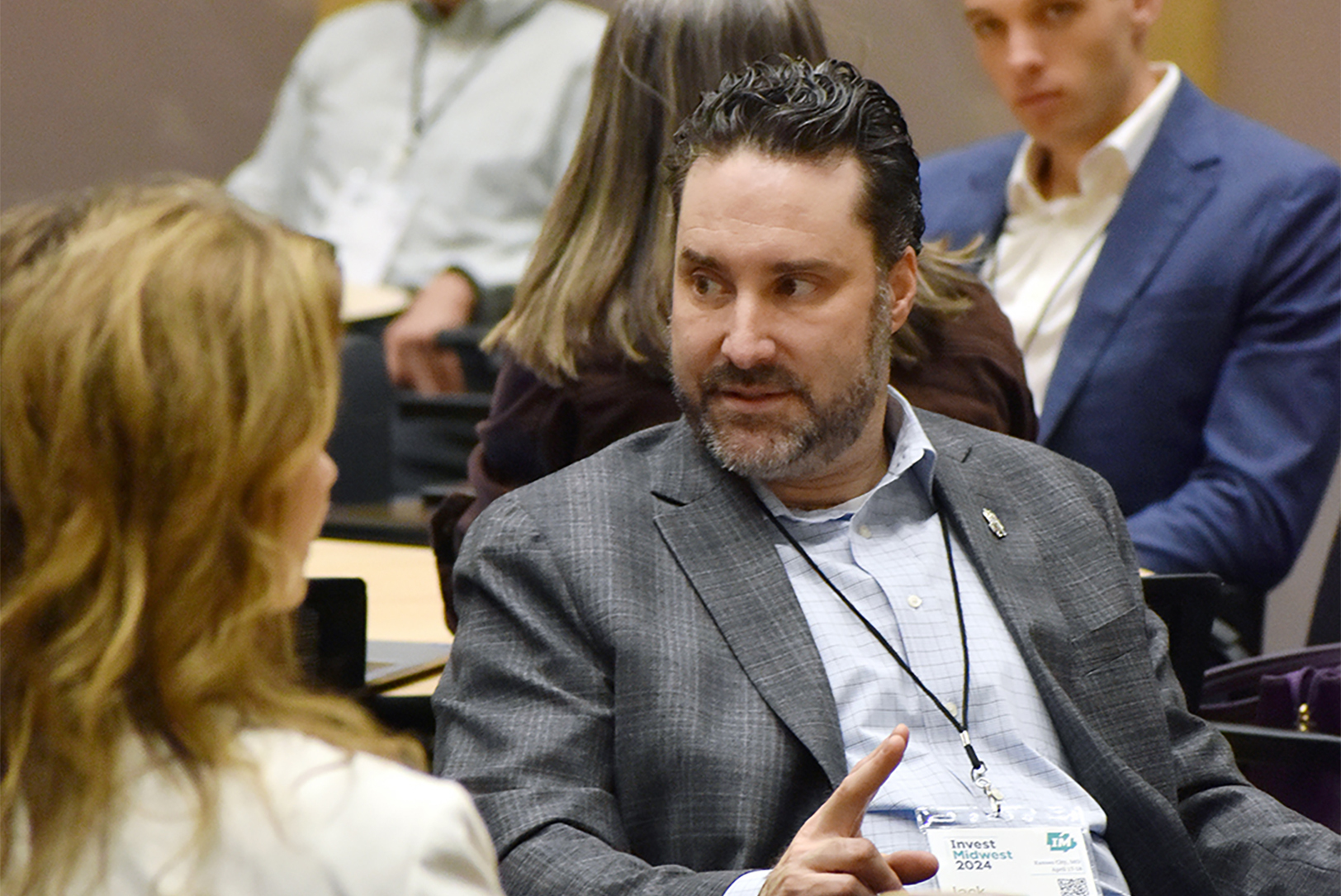 Jack Scatizzi, executive director of the Missouri Technology Corporation, speaks with fellow InvestMidwest attendees in mid-April in Kansas City; photo by Tommy Felts, Startland News