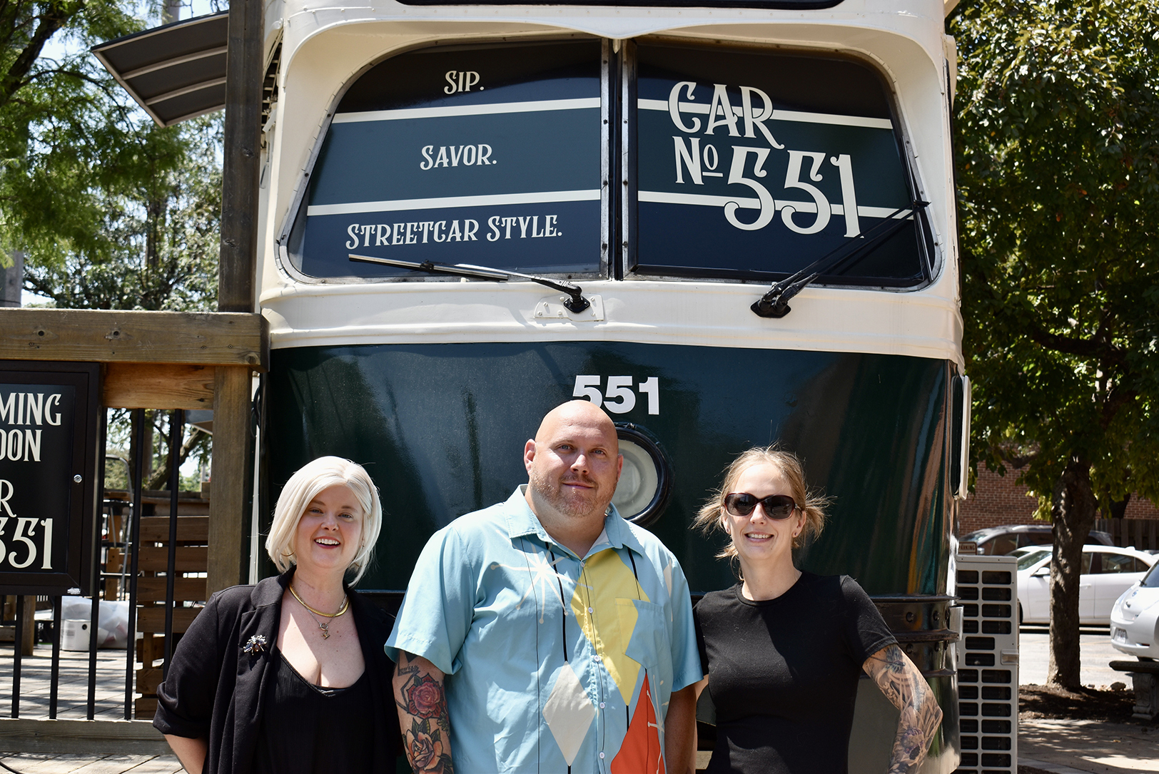 William Jordan, owner of Car No. 551, center, with Ashley Adams, acting bar manager, and Hayley O’Connor, head of operations, at the historic "Trolley Tom" in River Market; photo by Nikki Overfelt Chifalu, Startland News