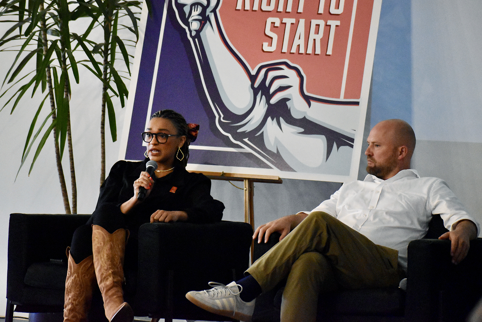 Taylor Overton, co-chair of the National Entrepreneurship Leaders Network, speaks alongside Wes Rogers, 2nd District Councilman for KCMO and chair of the city's Small Business Taskforce, during a panel conversation about Kansas City small business preparedness for the FIFA World Cup in 2026; photo by Nikki Overfelt Chifalu, Startland News