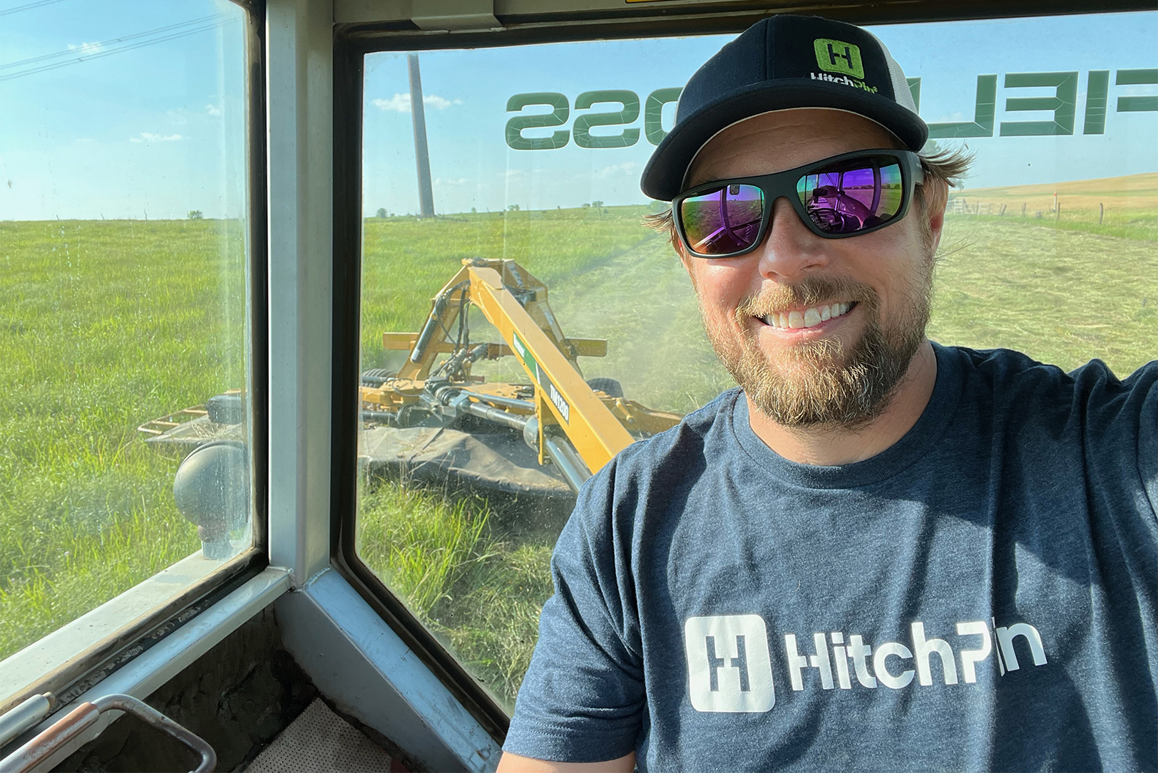 Trevor McKeeman, founder of HitchPin, swathing in a Kansas field; courtesy photo