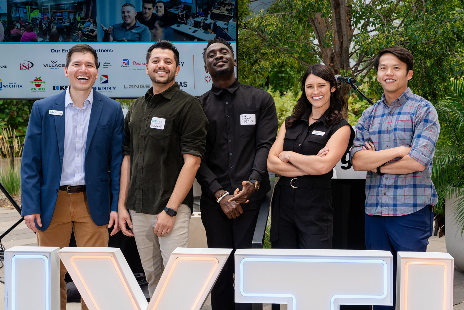 Amber Dunn, program manager for Wichita-based NXTUS, second from right, stands with founders Donnie Hampton, Roz; Gharib Gharibi, Archia.io; and Zik Nwanganga and Bing Low, Ulom; during Launch Week in Wichita; photo courtesy of NXTUS