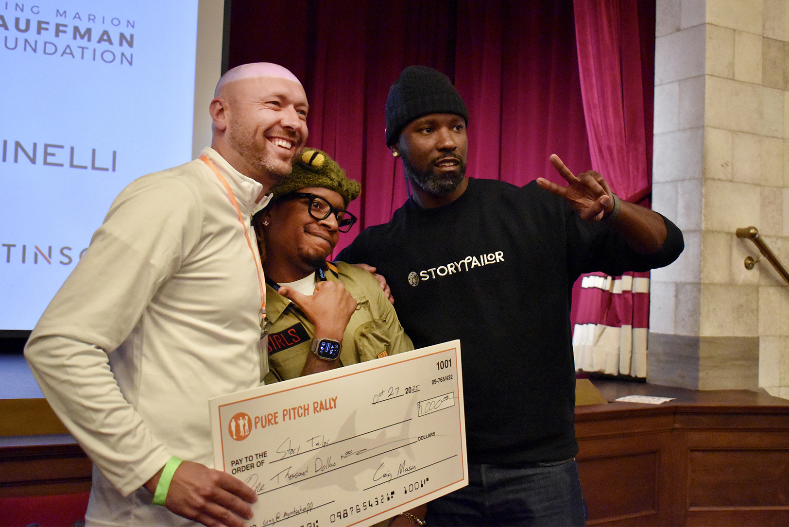 Craig Mason, Myndset, poses with JQ Sirls and Herston Fails, StoryTailor, after awarding them with his "Land Shark" check at Pure Pitch Rally; photo by Taylor Wilmore, Startland News