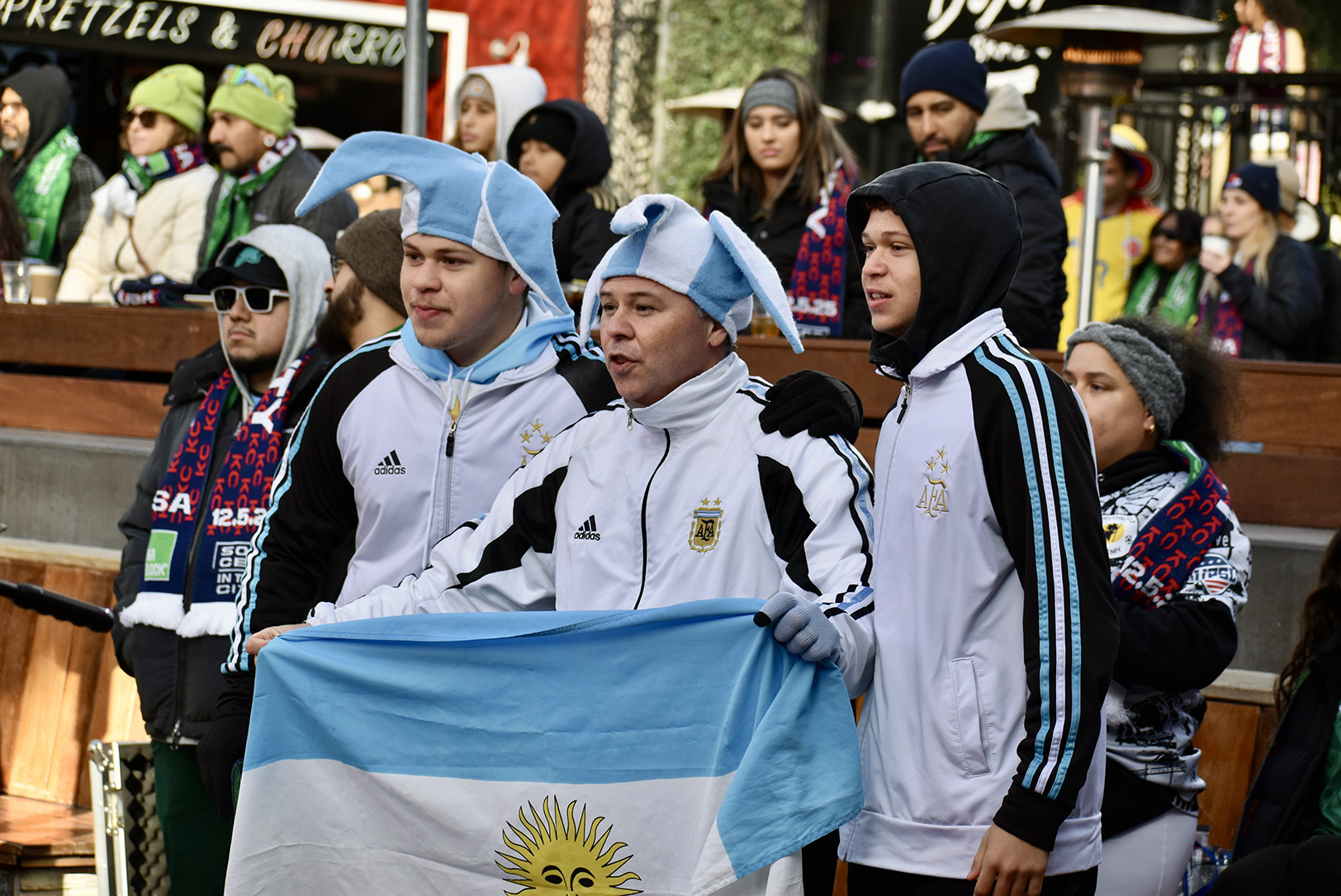 Argentina fans raise their flag during a Dec. 5 final draw announcement event for the FIFA World Cup at Kansas City's Power and Light District; photo by Nikki Overfelt Chifalu, Startland News