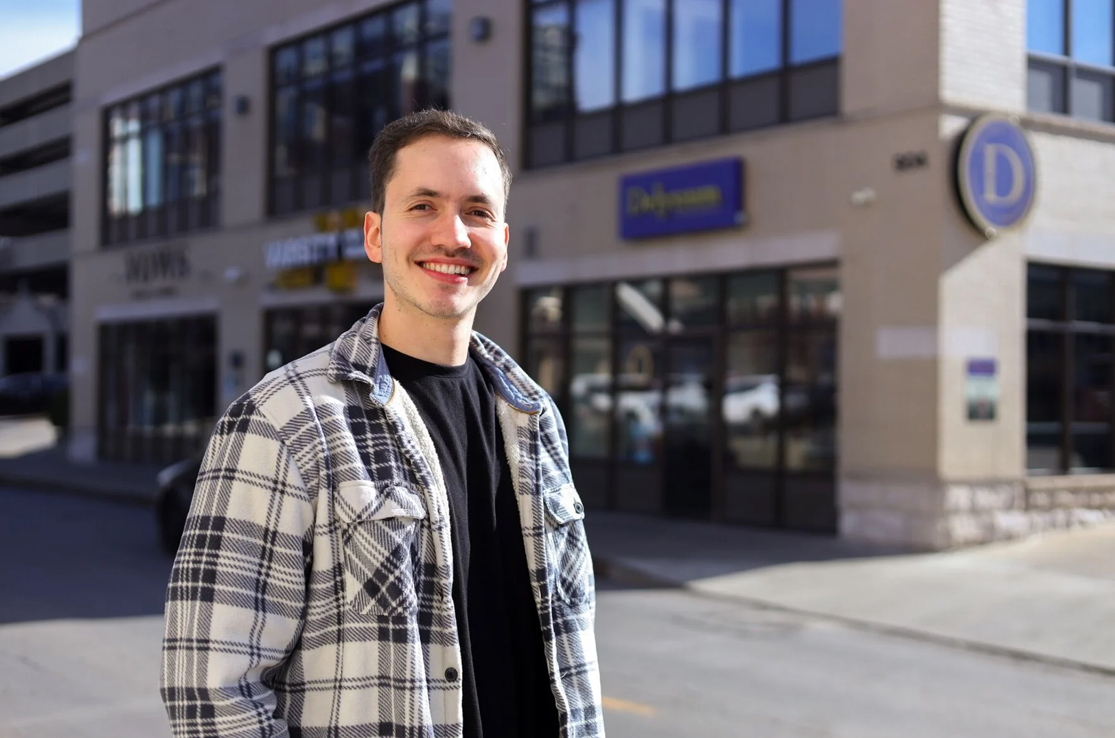 Pablo Giraldo stands in front of his family-owned business, Delysium Artisan Bakery, in downtown Columbia. The bakery opened in August 2024; photo by Elizaveta Orlova, Missouri Business Alert