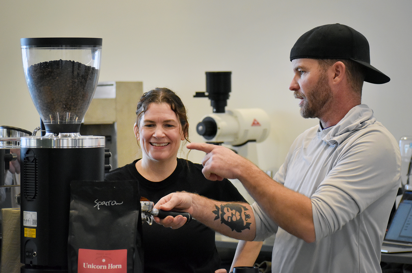 Sparrow Coffee Co. co-founders Jaime McKinley and Jeremy Layden work to set up their new coffee shop inside the new Link Innovation Labs space in Topeka; photo by Tommy Felts, Startland News