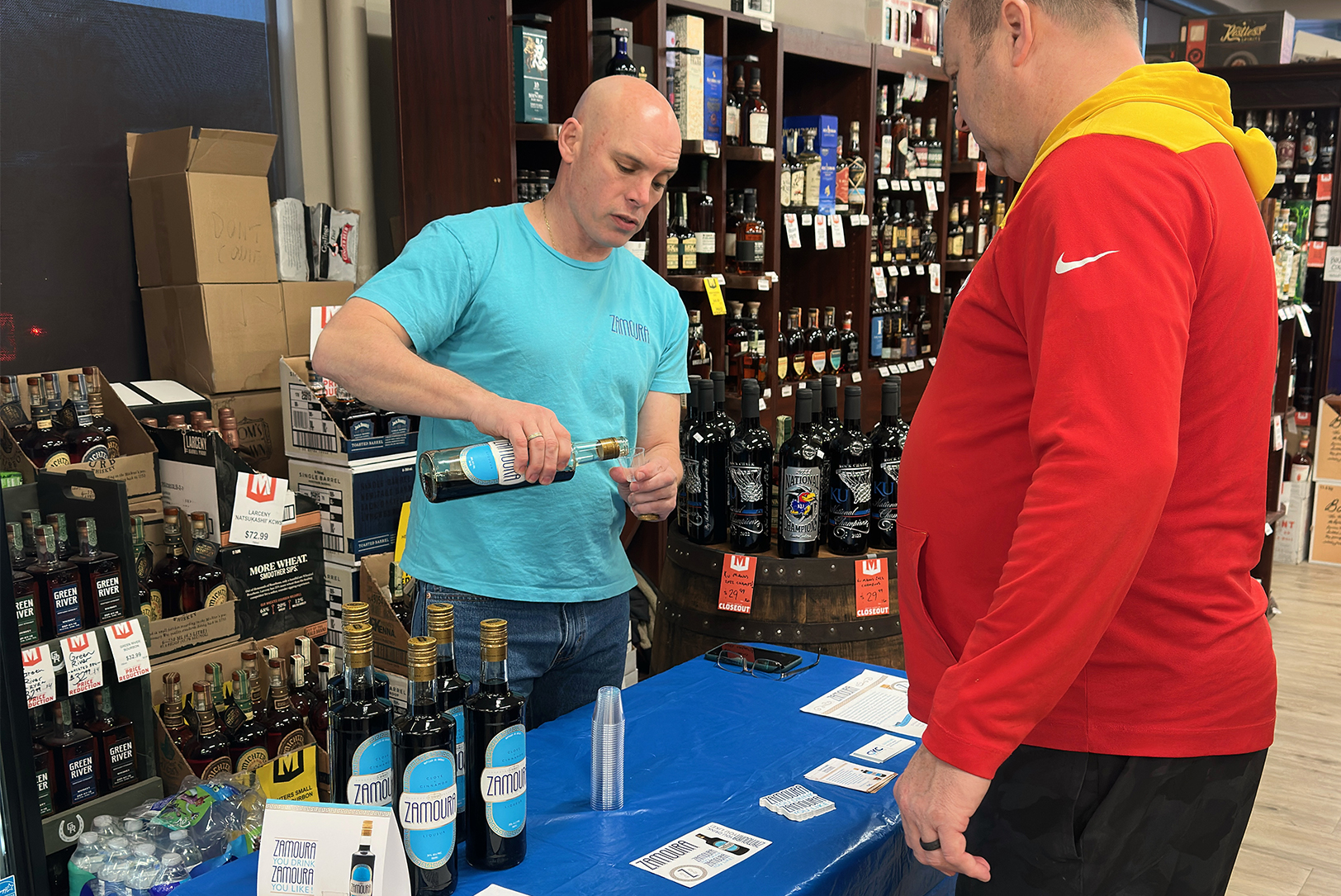 Glen Shilland serves Zamoura during a tasting event at Mike’s Wine and Spirits in Waldo; photo by Joyce Smith