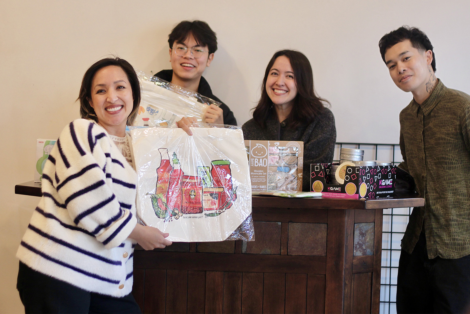 Hella Good Deeds team members Béty Lê Shackelford, Cheyenne Nguyen, Lauri Pham, and Xay Vongxay show off a few of the items that will be for sale at Jade Market; photo by Nikki Overfelt Chifalu, Startland News