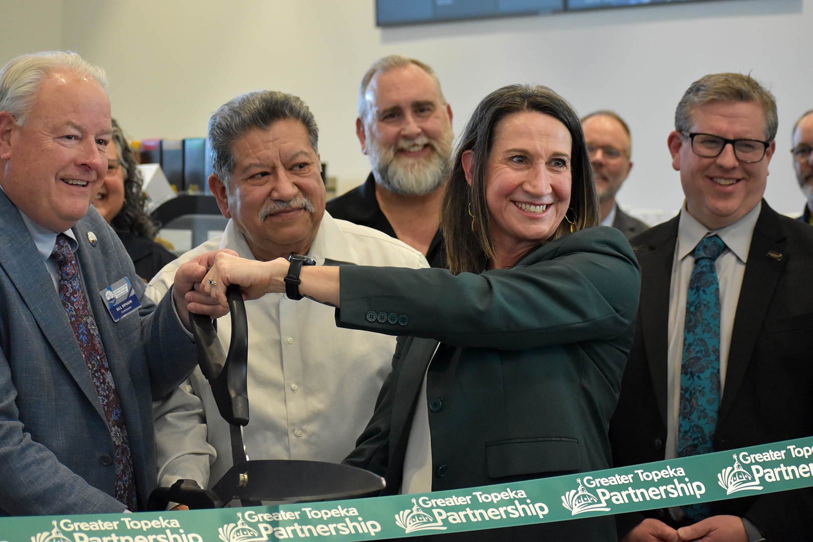 Stephanie Moran, GO Topeka, joins a crowd of civic and corporate leaders to cut the ribbon on the Link Innovation Labs in Topeka; photo by Taylor Wilmore, Startland News