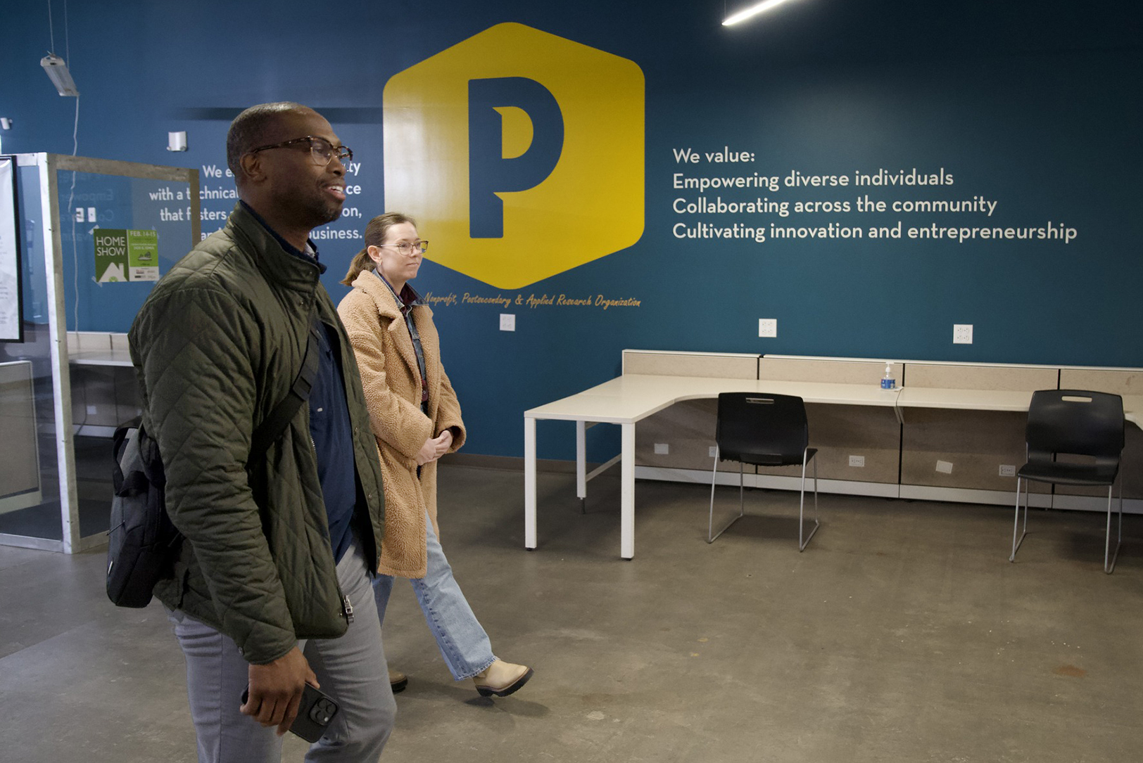 Michael Odupitan and Jessica Pauly, of Omni Circle, tour Peaslee Tech, where Ignite sessions are planned; courtesy photo
