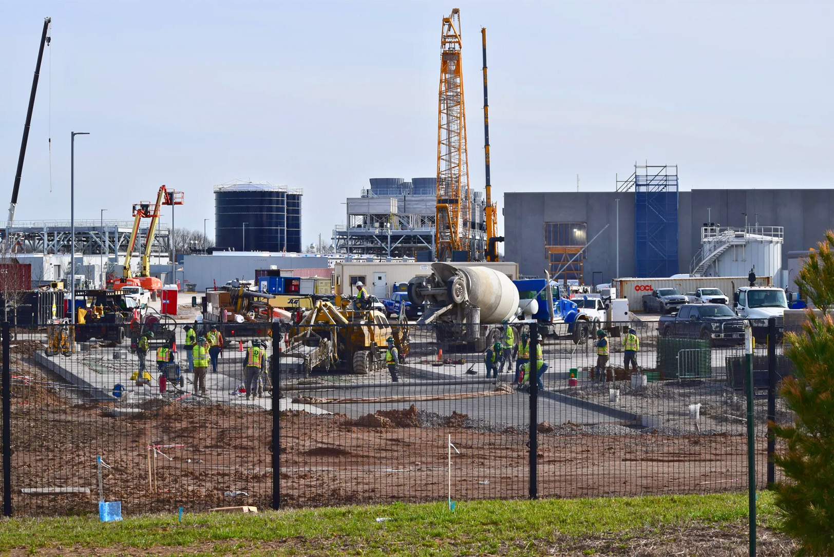 Workers pour concrete at the Google data center campus near Worlds of Fun, where the project is reported to employ roughly 1,000 construction workers; photo by Thomas White, The Beacon
