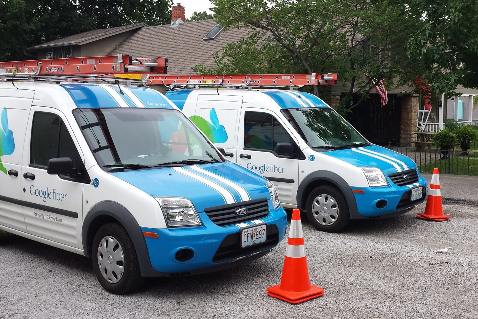 Newly minted Google Fiber vans sit outside the home in the Kansas City Startup Village where the first installation of Google Fiber was documented in 2012; Startland News photo