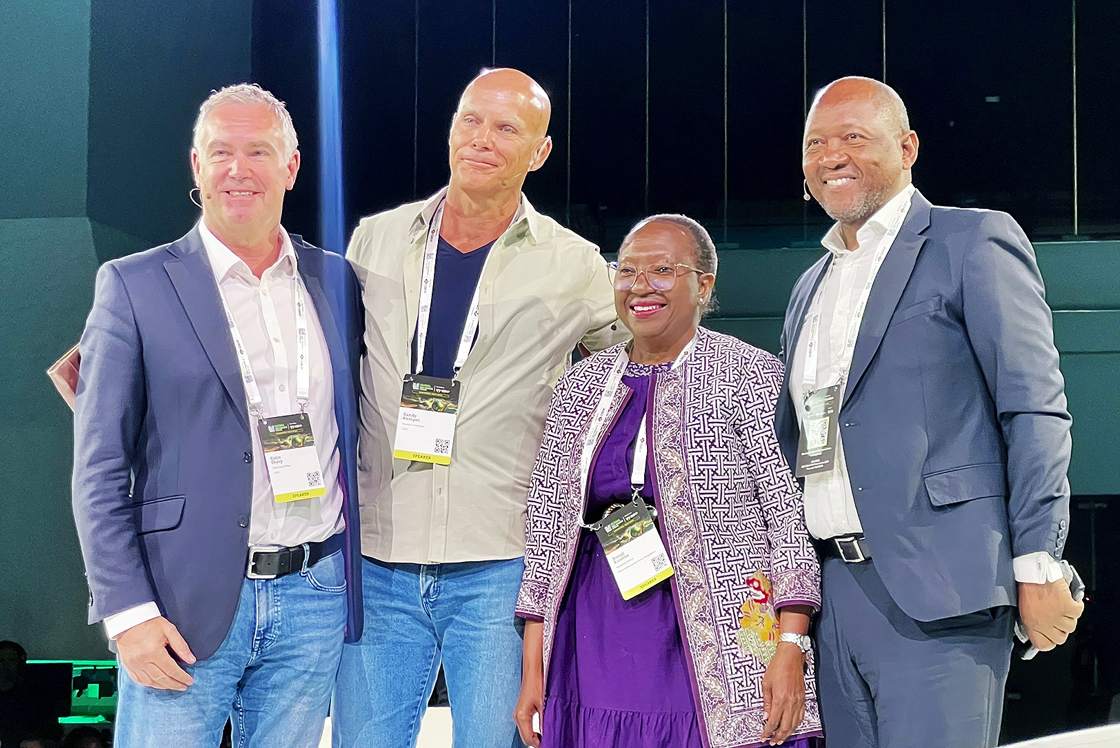 Colin Sharp, chief sales officer at C2FO, and Sandy Kemper, CEO and founder of C2FO; stand with fellow roundtable panelists Bongi Kunene, managing director for the Banking Association South Africa; and Dr. Andile Ngcaba, chairman of Solcon Capital, during the Global SME Finance Forum in Johannesburg, South Africa in 2025; photo courtesy of C2FO