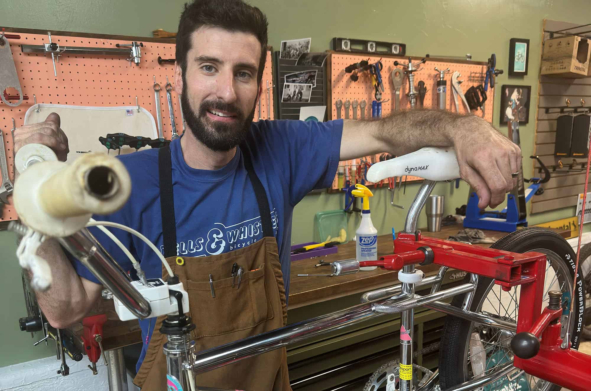 Aaron Apel inside Bells & Whistles Bicycle Repair, 7140 W 80th St, Overland Park; photo by Joyce Smith
