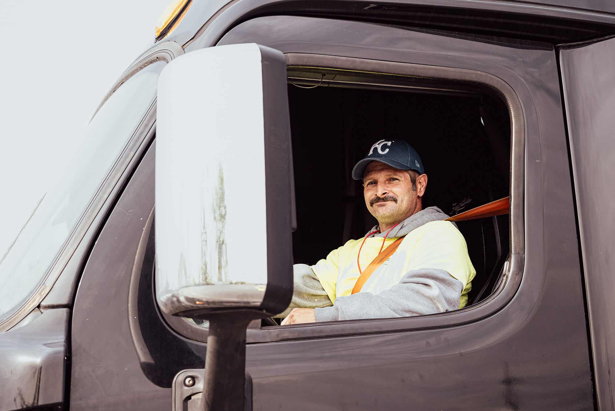 A CDL driver scholar from Great Jobs KC sits behind the wheel; courtesy photo