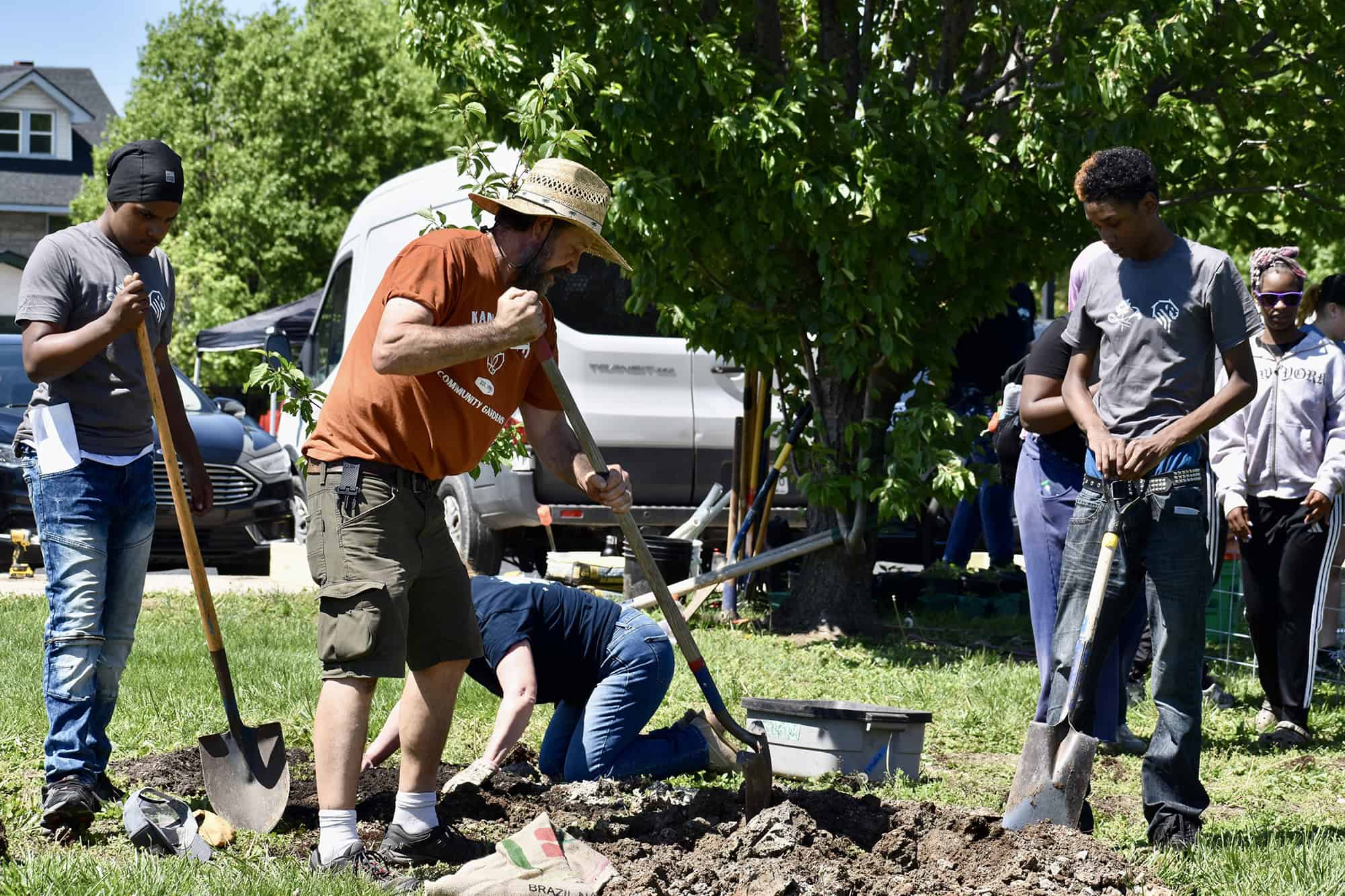 Volunteers and students dig in the soil for the DeLaSalle Learning Farm project outside DeLaSalle High School; photo by Nikki Overfelt Chifalu, Startland News