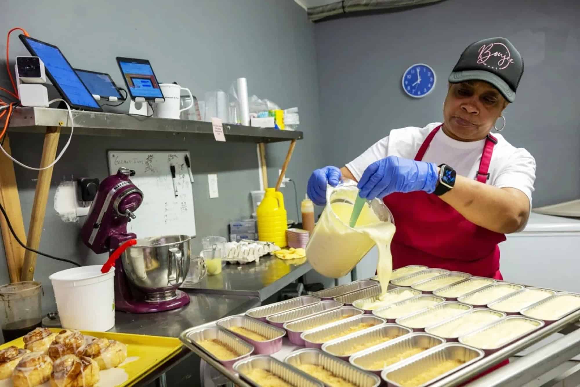 Boujee Bakery owner Joyce Watts prepares cheesecakes early in the morning at her establishment on 2311 E. 12th St. in Kansas City, Missouri. Flavors include salted caramel, Oreo, lemon and sweet potato; photo by Todd Feeback, Flatland