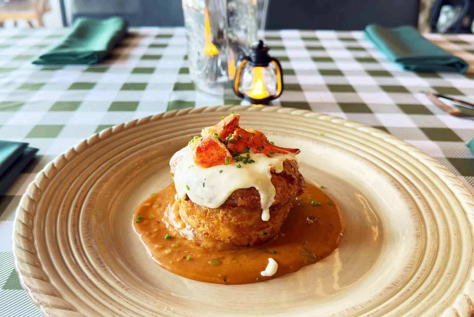 Frankie Pickle’s signature dish: the cheddar chive lobster roll, shaped like a cinnamon roll with a lobster mousse filling, lobster veloute, white cheddar bechamel and warm tarragon lobster salad; photo by Joyce Smith