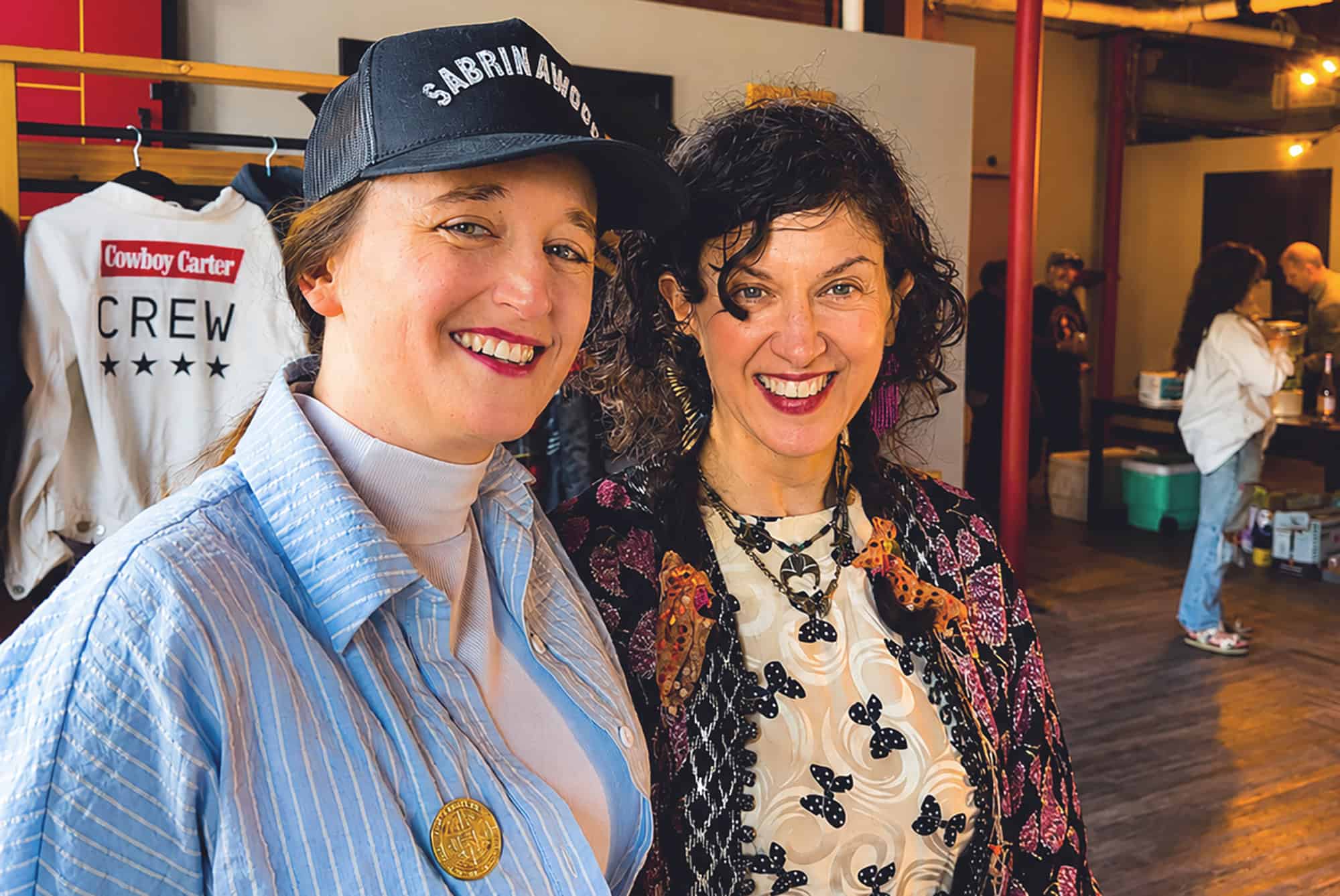 Paige Beltowski, owner of Cut & Sew Production KC, and Peregrine Honig, co-owner of Birdies, at a friends and family inside the new Cut & Sew space at 510 Delaware St. Both Beltowski and Honig are members of the inaugural Open Doors! cohort; photo by Joyce Smith