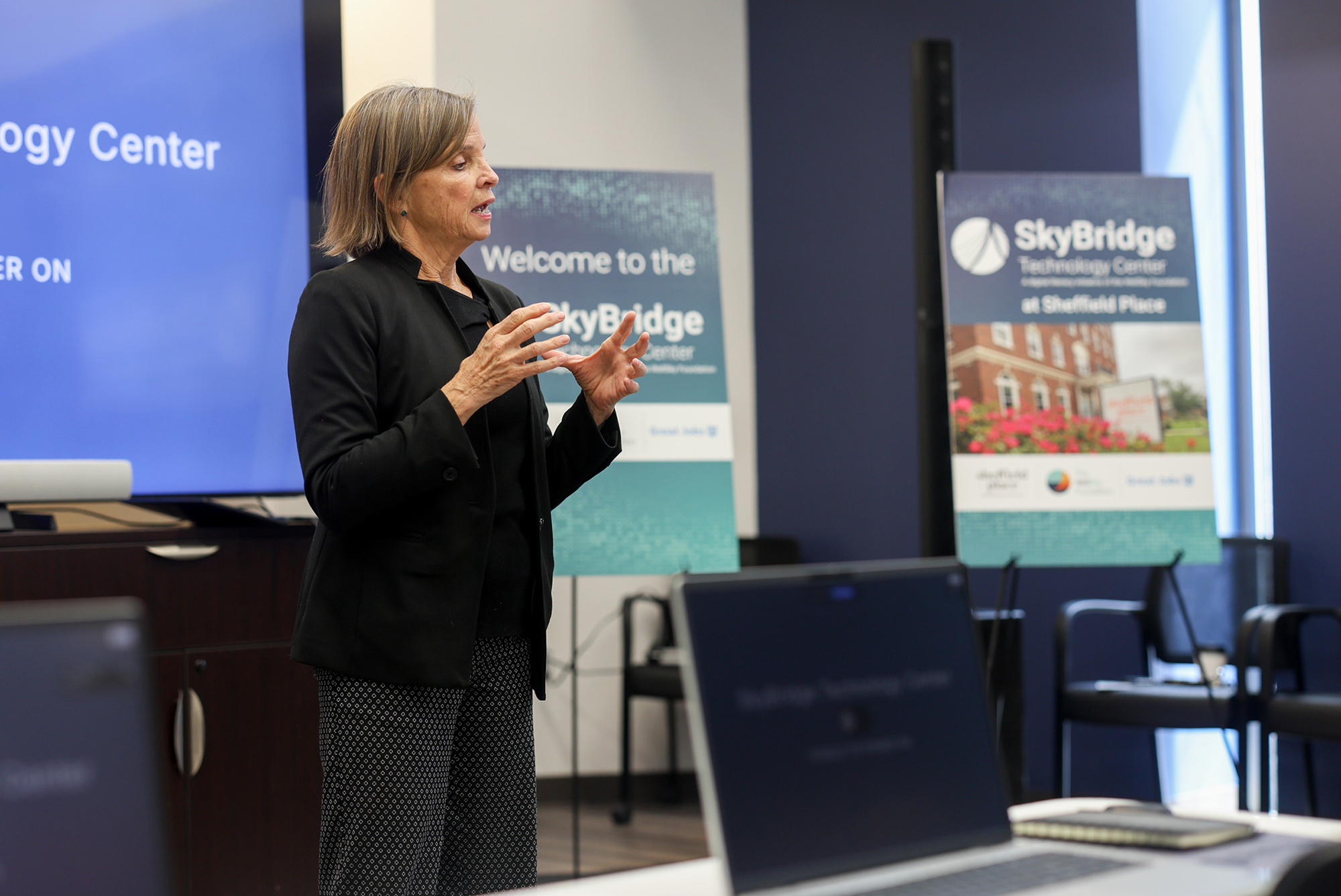 Kelly Welch, CEO and president of Sheffield Place, speaks during a grand opening event for SkyBridge Technology Center at reStart; courtesy photo