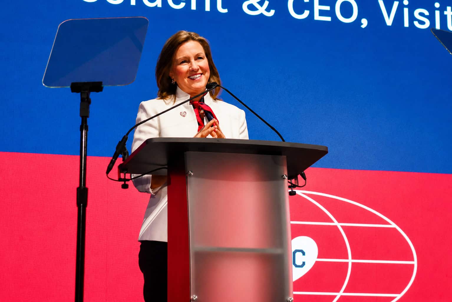 Kathy Nelson, president and CEO of Visit KC, smiles on stage at Municipal Auditorium during Visit KC's Annual Tourism Outlook event; photo by Nikki Overfelt Chifalu, Startland News