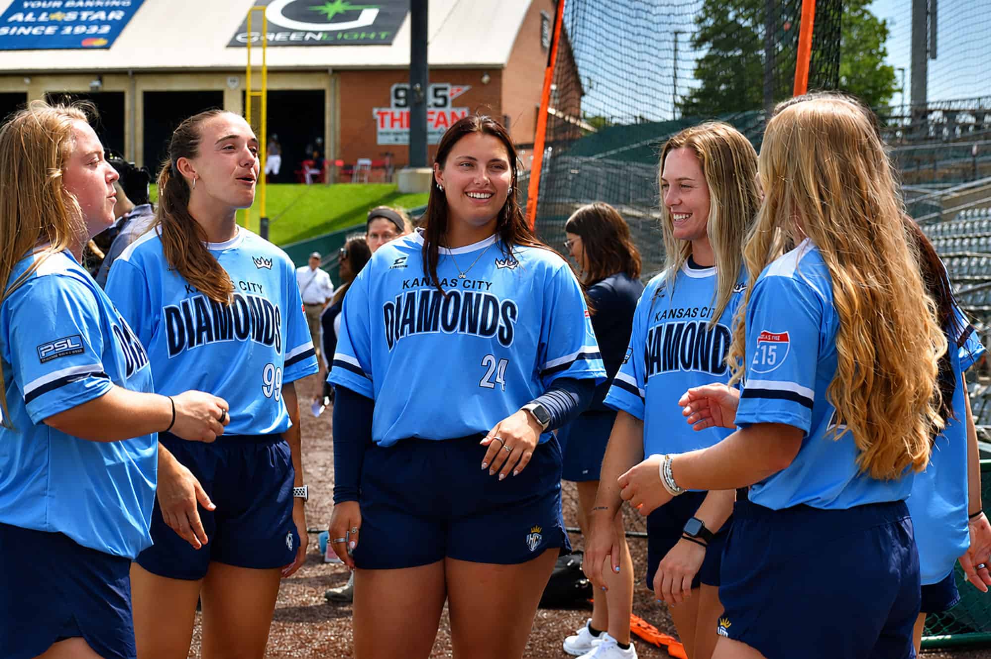 KC Diamonds teammates share laugh after a team cheer during a media day event at Legends Field; photo by Morgan Yeates, Startland News