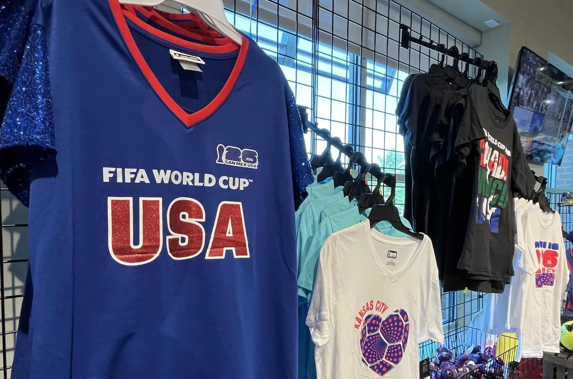 Assorted World Cup T-shirts line a wall at a Hy-Vee location in Lee's Summit. The grocer started stocking apparel this spring for the soccer tournament; photo by Missouri Business Alert