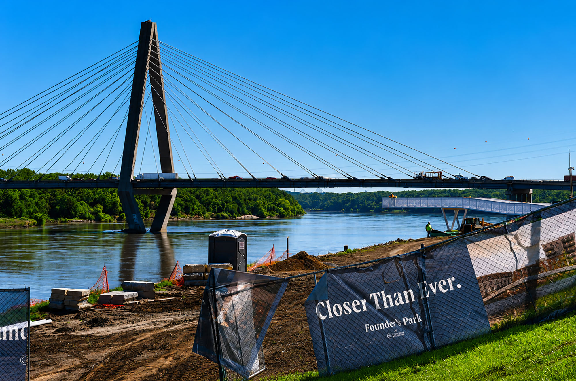 Construction continues at the Founder's Park site along the Missouri River, near CPKC Stadium, with  the Christopher S. Bond Bridge in the distance; photo by Tommy Felts, Startland News