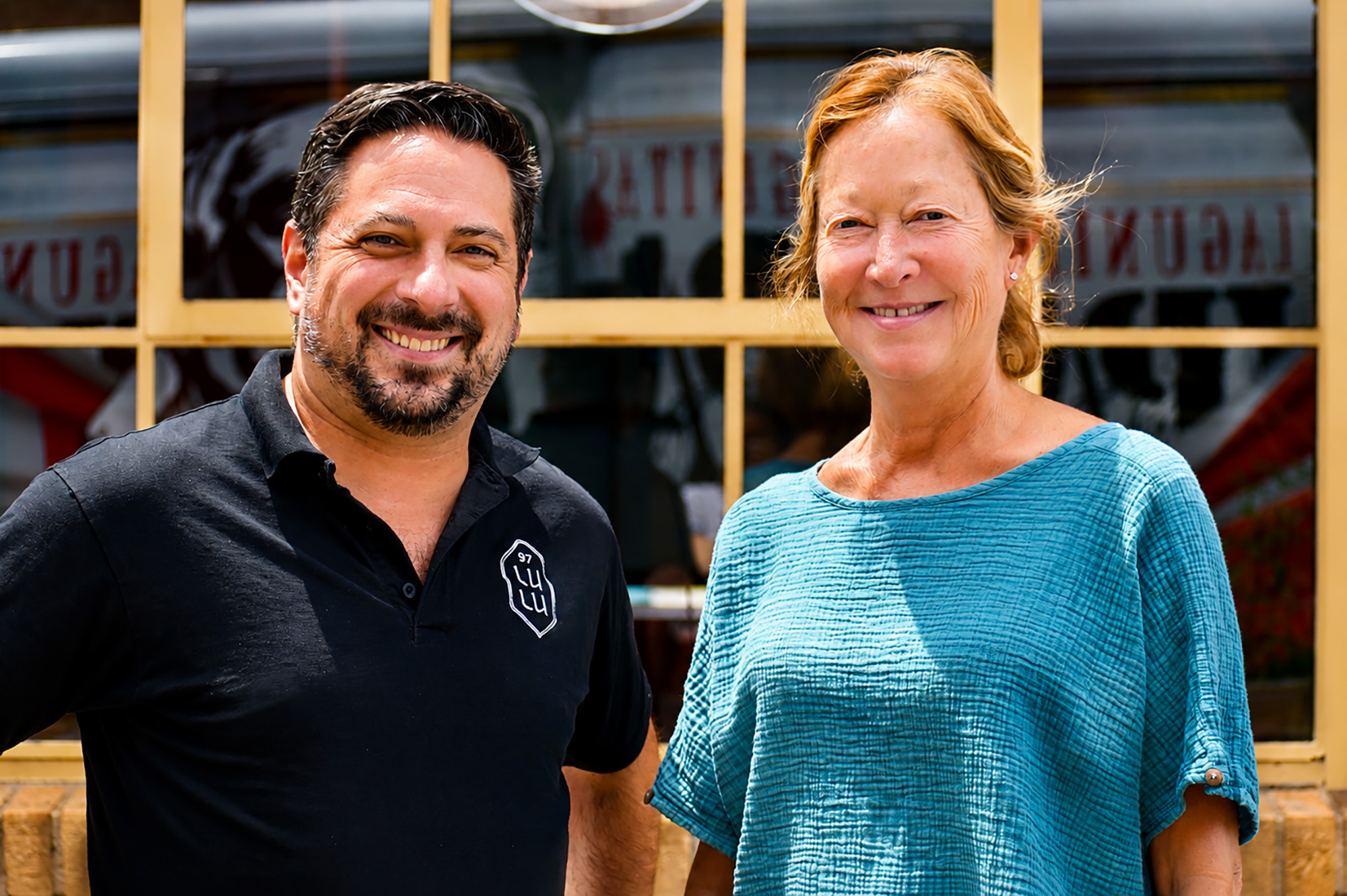 Nick Jovanovic, vice president of operations for Lulu's Thai Noodle Shop, with founder Malisa Monyakula outside the restaurant's Crossroads location; photo by Taylor Wilmore, Startland News