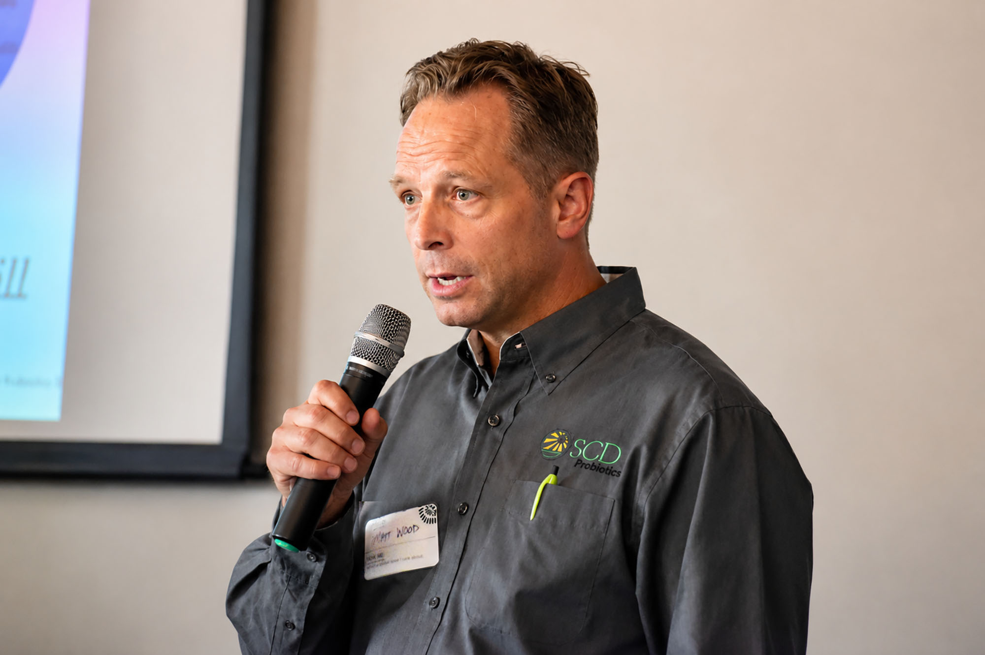 Matt Wood, founder of SCD Probiotics, speaks in the Crossroads at Outreach International's headquarters; photo by Nikki Overfelt Chifalu, Startland News