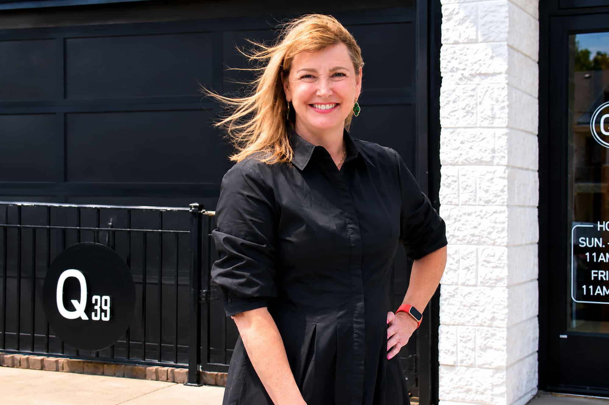 Kelly Magee, founding partner of Q39, stands in front of the brand's 39th Street location; photo by Taylor Wilmore, Startland News
