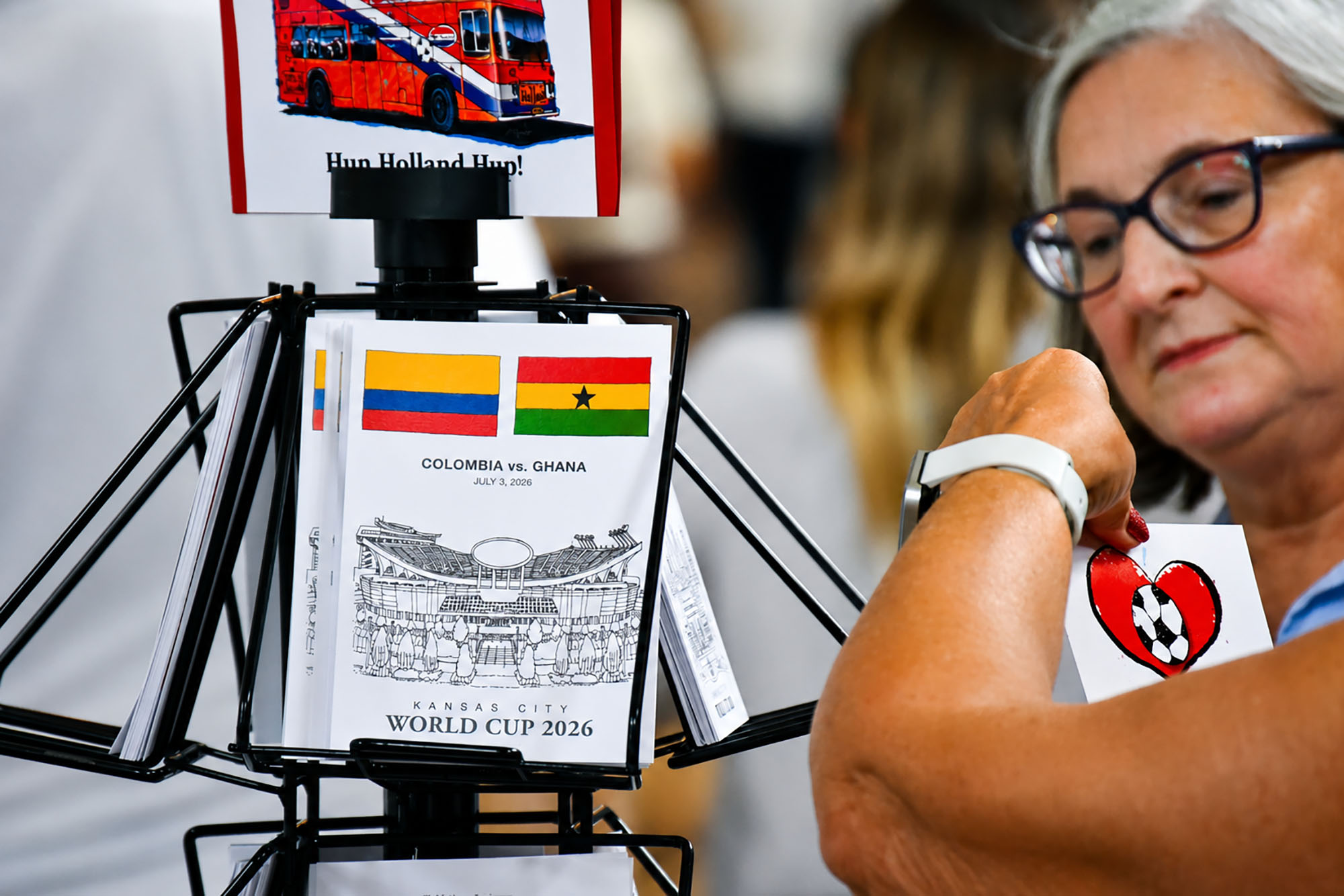 Custom card prints by Kansas City artist D.E.Uhlig feature the Colombia-Ghana matchup at a booth for "The Happiness of Art" within the City of Entrepreneurs marketplace at Union Station; photo by Tommy Felts, Startland News