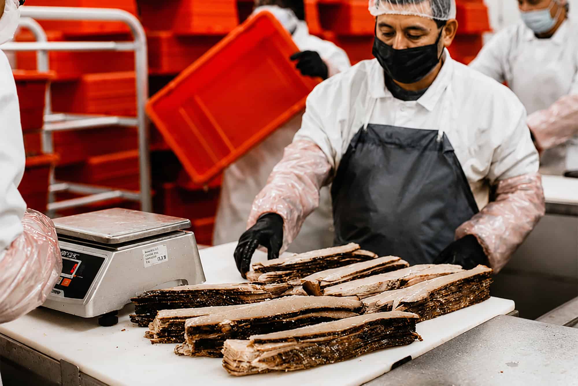 Workers process beef brisket at the current Kansas City Hickory Provisions facility in Alma, Missouri; photo courtesy of Kansas City Hickory Provisions