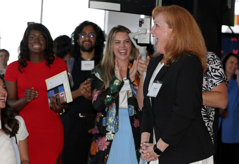 Liz Benditt, right, president and CEO of Balm Box and a Verizon Small Business Super Pitch finalist, reacts during the Verizon Small Business Super Pitch final in Hoboken, New Jersey; photo by Adam Hunger/AP Content Services for Verizon Business