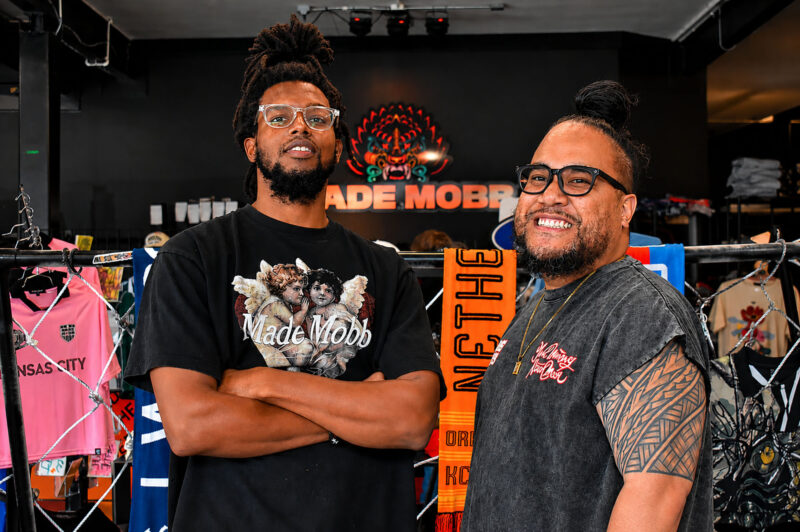 Alex Harris, shop manager at MADE MOBB, and Mark Launiu, co-founder of the Kansas City streetwear brand, inside the MADE MOBB storefront at 221 Southwest Blvd; photo by Taylor Wilmore, Startland News