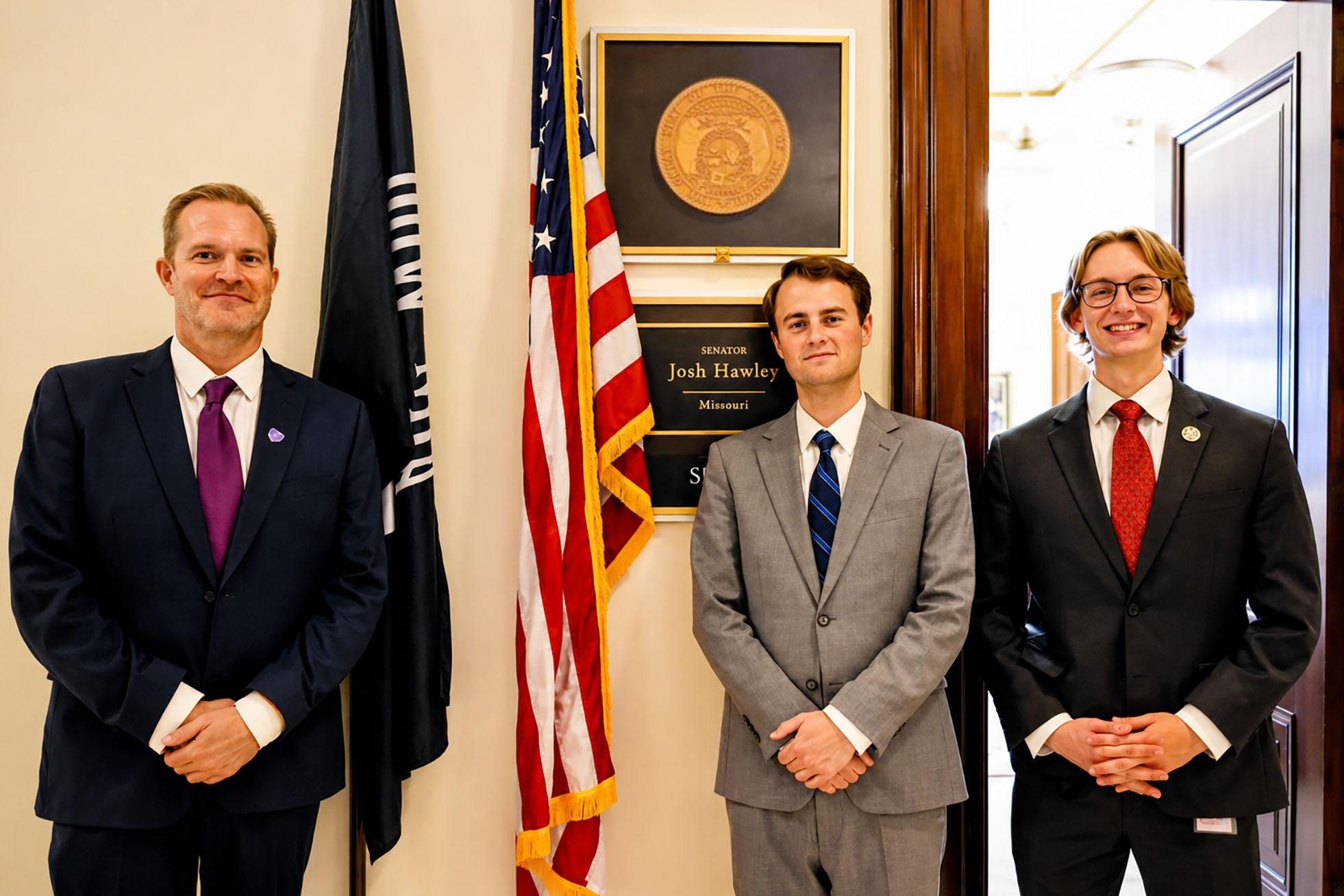 Ryan Wright, Stand With Crypto Missouri, left, stands outside U.S. Sen. Josh Hawley's office in Washington D.C. with legislative correspondent Jake Genualdi and Genualdi's assistant; courtesy photo