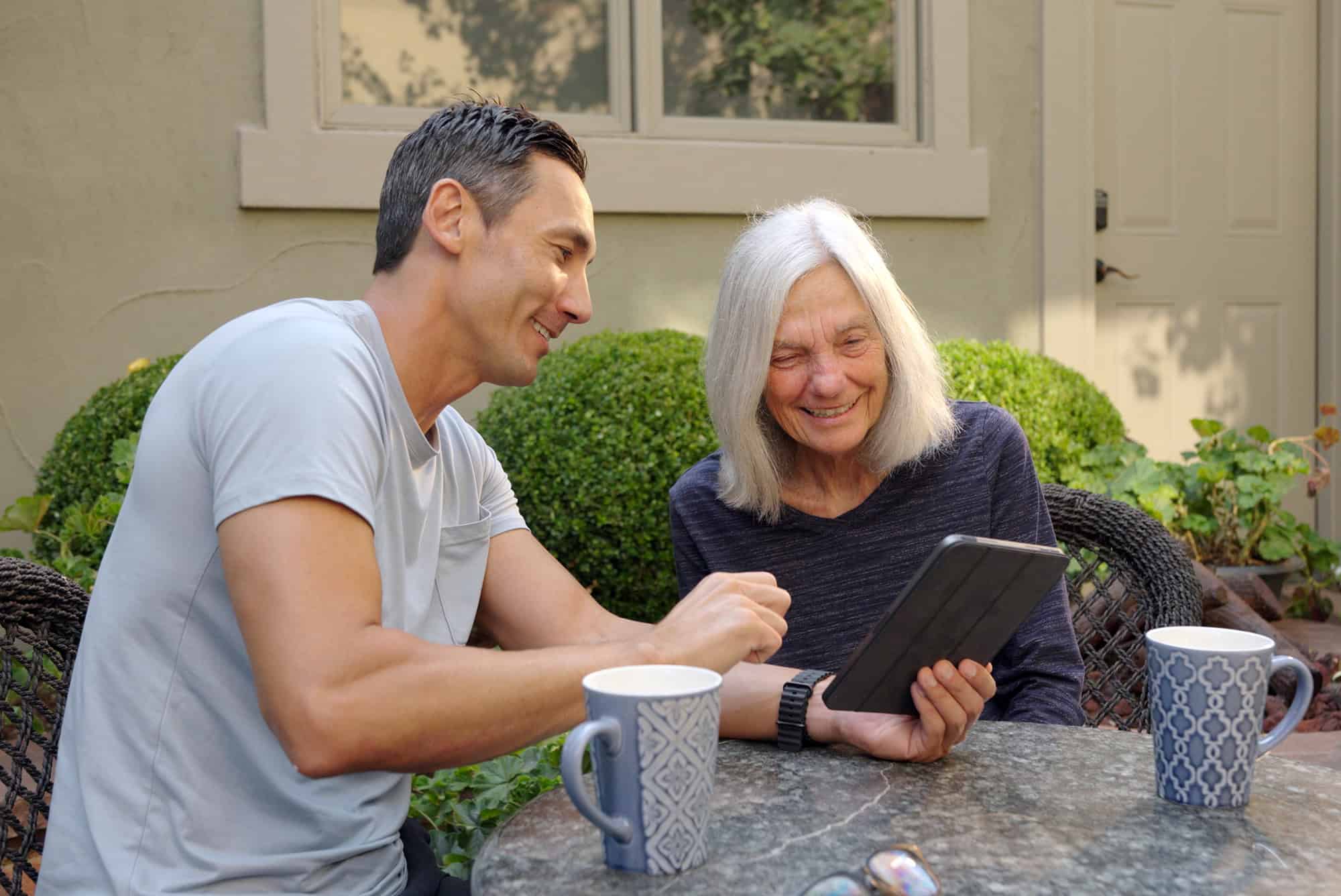 David Hensley, founder of Lisova, demonstrates the voice companion platform alongside his mother, Christy Hensley; courtesy photo