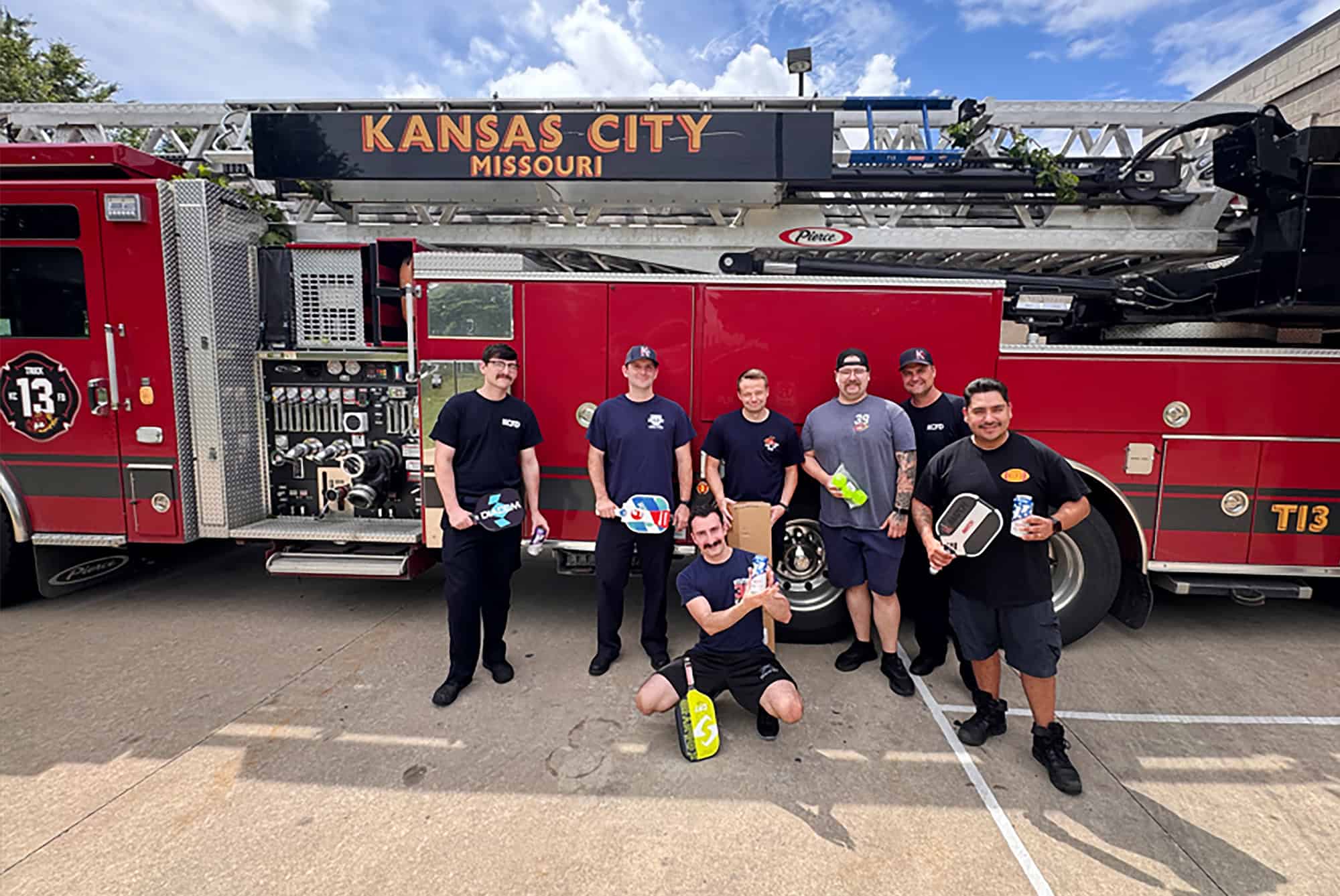 Pro Athlete presents a pickleball set to a crew of Kansas City, Missouri, firefighters; courtesy photo