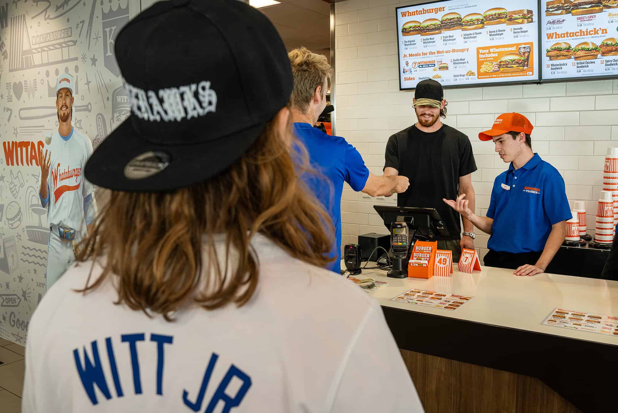 Kansas City Royals star shortstop Bobby Witt Jr. serves Whataburger during an in-store promotional event; courtesy photo