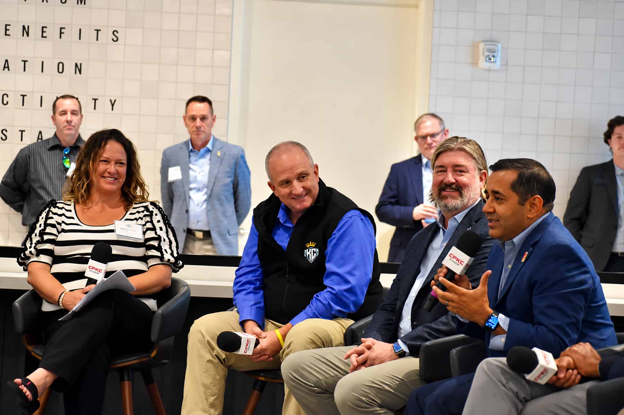 Neal Sharma, vice president of KC2026’s board of directors, right, speaks during a panel conversation Kansas City's sport identity at the 2026 Back2KC gathering at CPKC Stadium; photo by Nikki Overfelt Chifalu, Startland News