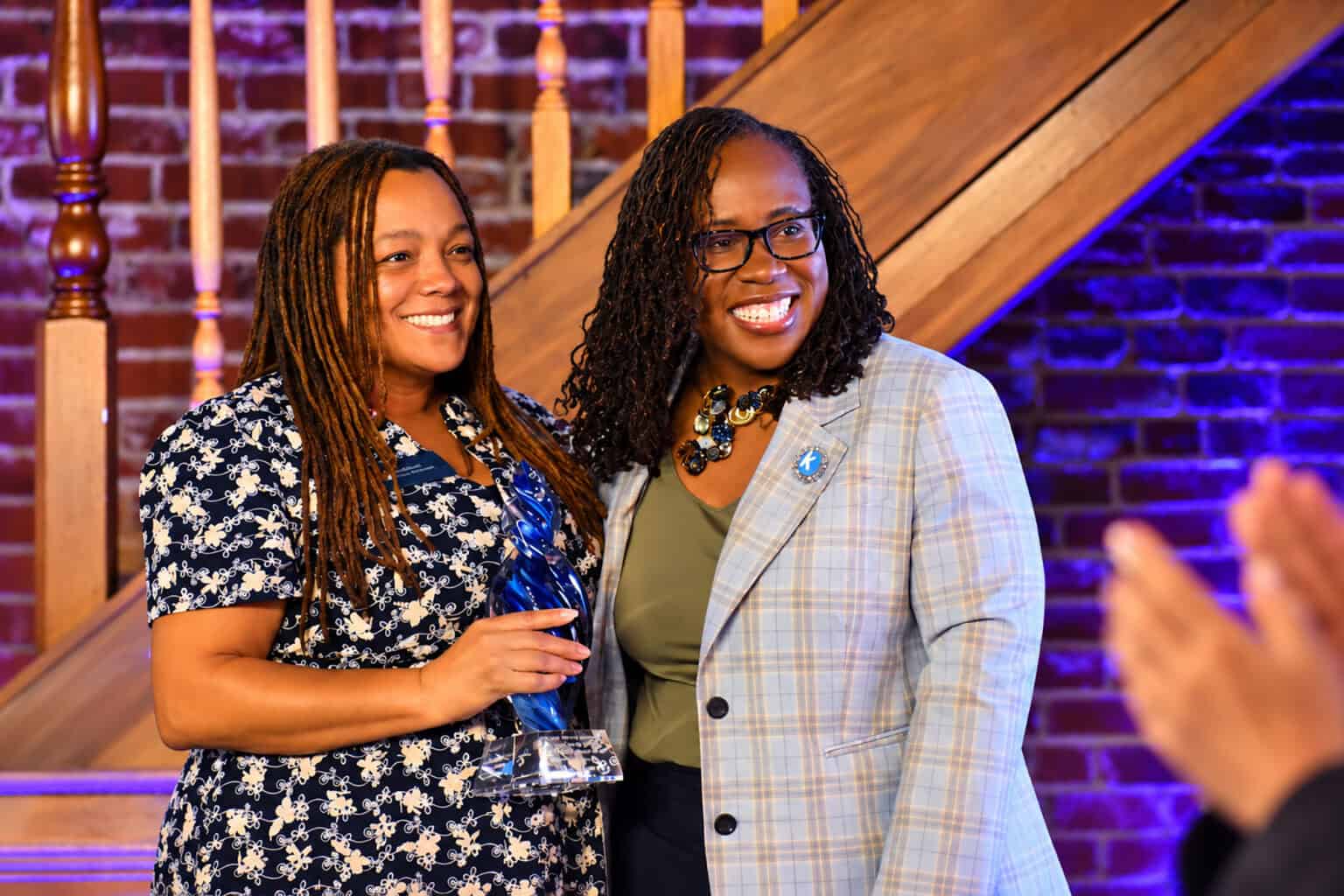 Tysie McDowell, founding superintendent of Crossroads Charter Schools, accepts the Kauffman Uncommon Leader Visionary Award from Dr. DeAngela Burns-Wallace, president and CEO of the Kauffman Foundation; photo by Tommy Felts, Startland News
