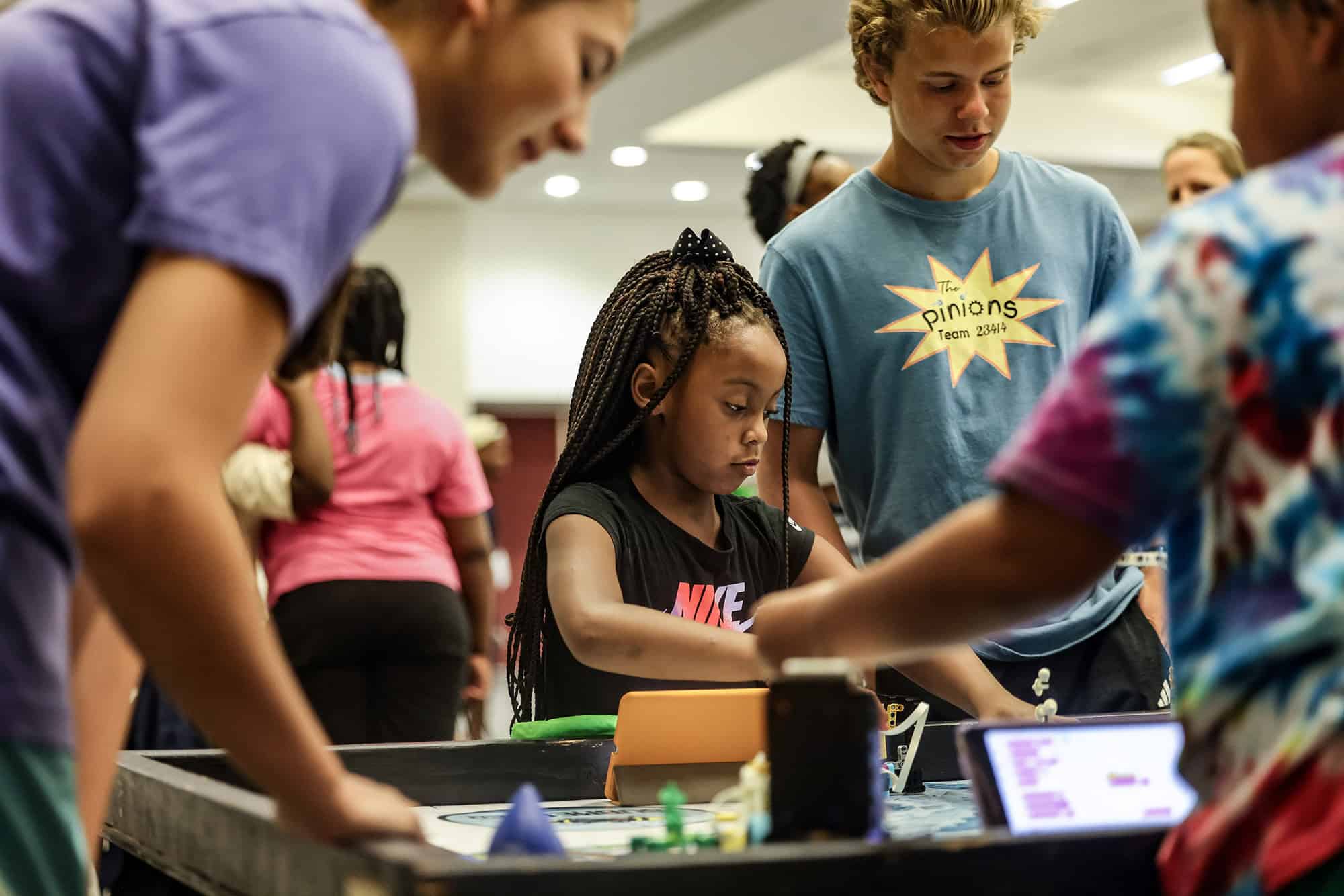 A student explores a Kids Tech Day activation during the 2025 event; photo courtesy of WeCode KC