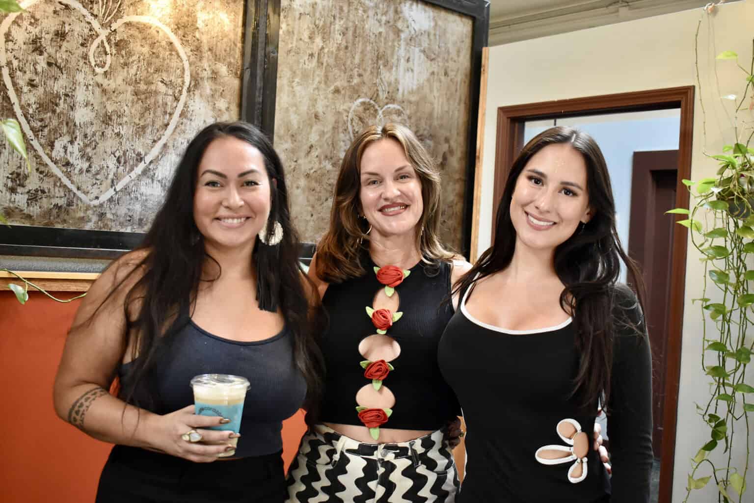 Alex Villalobos-McAnderson, Villalobos Vitality; Jess Rogers, Cougar Club; and Dulcinea Herrera, Café Corazón, stand together at Café Corazón; photo by Nikki Overfelt Chifalu, Startland News